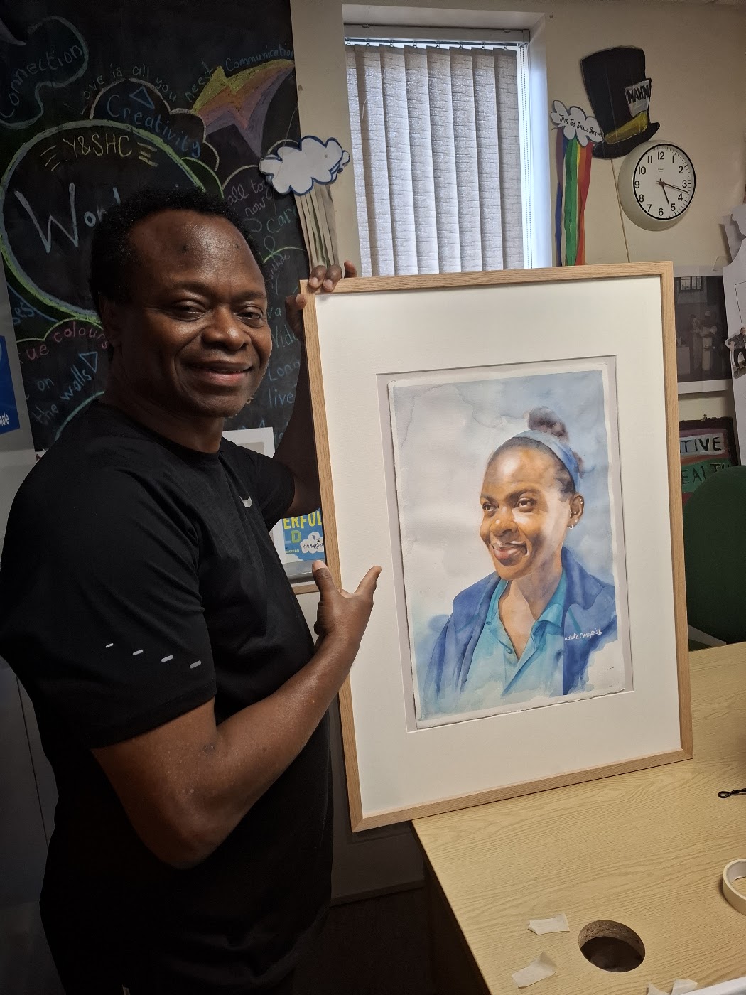 Nduka Omeife with his Black History Month portrait, York Hospital exhibition 2026, photograph 3