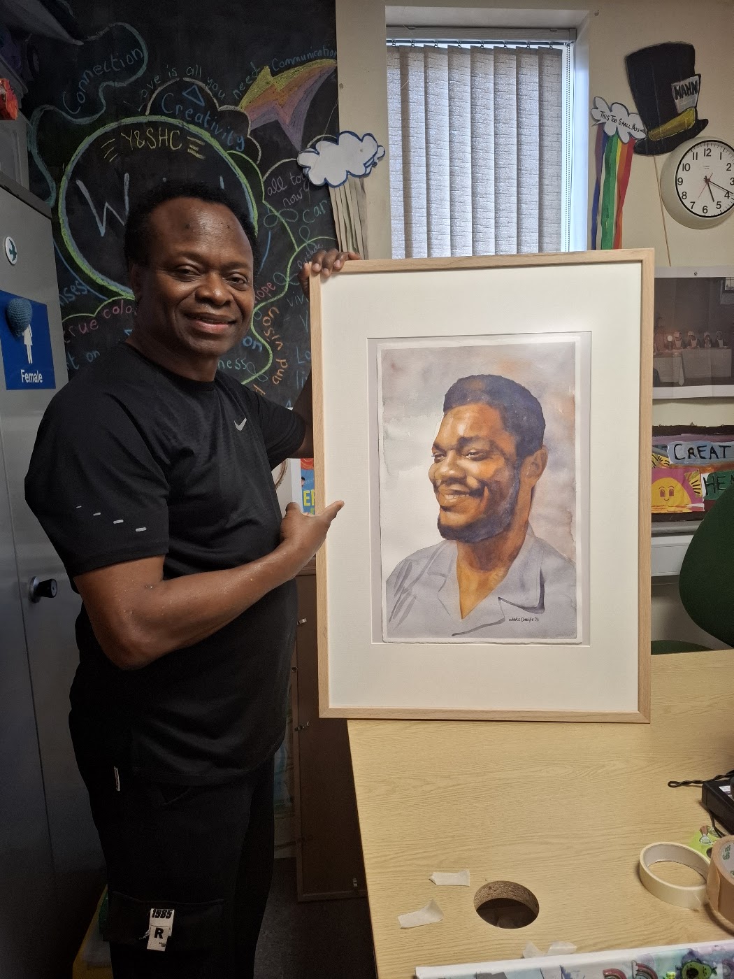 Nduka Omeife with his Black History Month portrait, York Hospital exhibition 2026, photograph 6