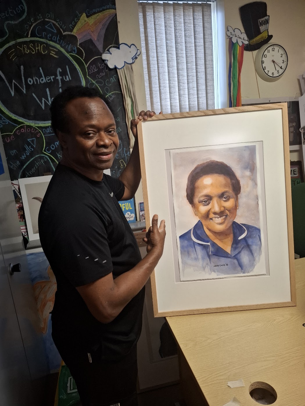 Nduka Omeife with his Black History Month portrait, York Hospital exhibition 2026, photograph 9